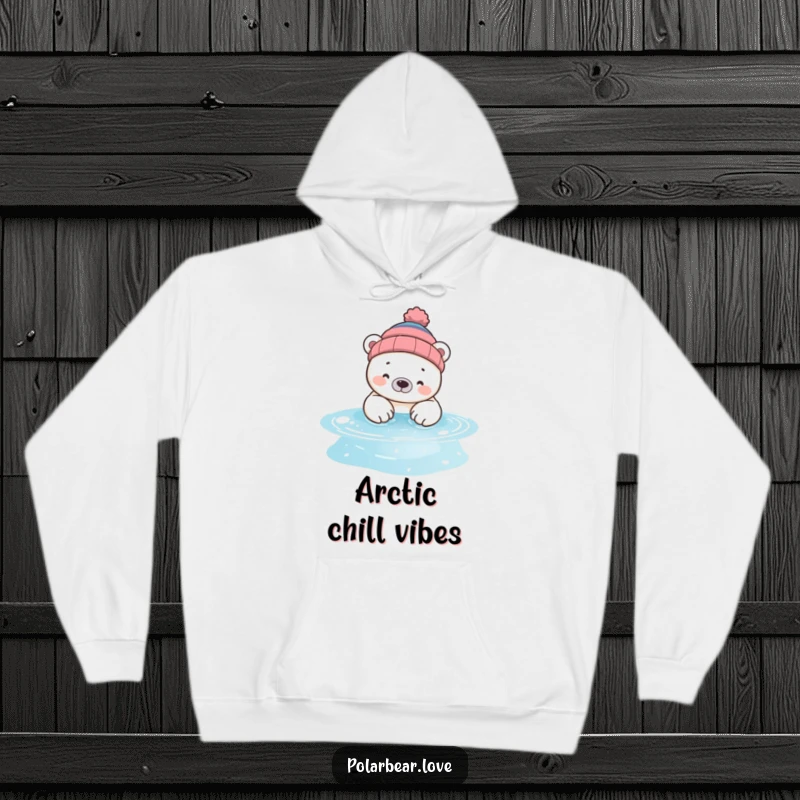 Funny polar bear hoodie featuring a bear in a beanie, happily dipping paws into a shimmering pool, perfect for cozy silliness.
