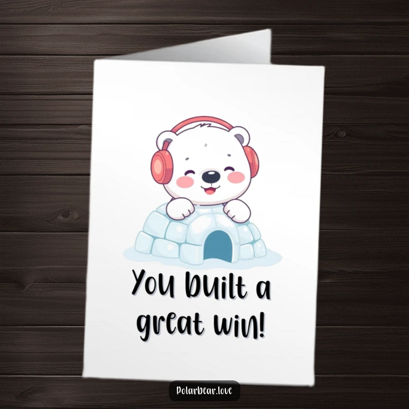 Charming Free Printable Congratulations Card: Content polar bear in earmuffs happily builds a sparkling igloo, celebrating success.
