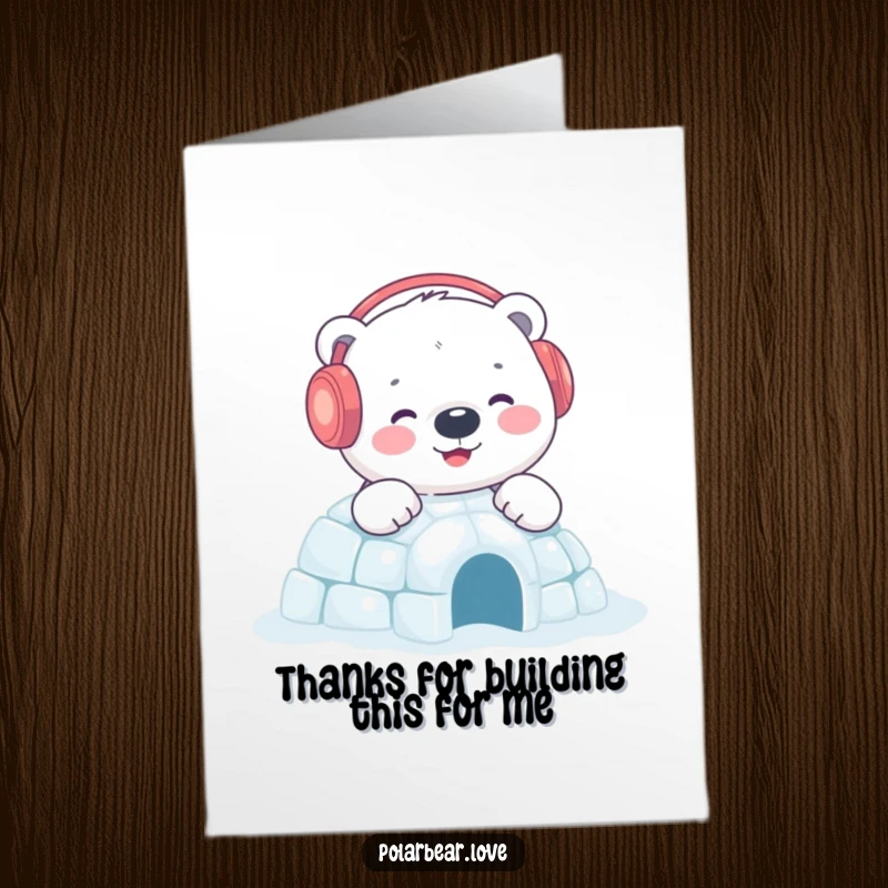 Charming Free Printable Thank You Card: Polar bear in earmuffs happily builds a sparkling igloo, offering warm thanks.
